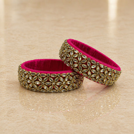 Vibrant fuchsia indian silk thread bangles for women featuring intricate gold-toned metalwork and marquise-cut stones