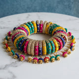 Silk thread bangles designer kundan bracelet set with vibrant colors gold embellishments and dangling jingle bells for weddings