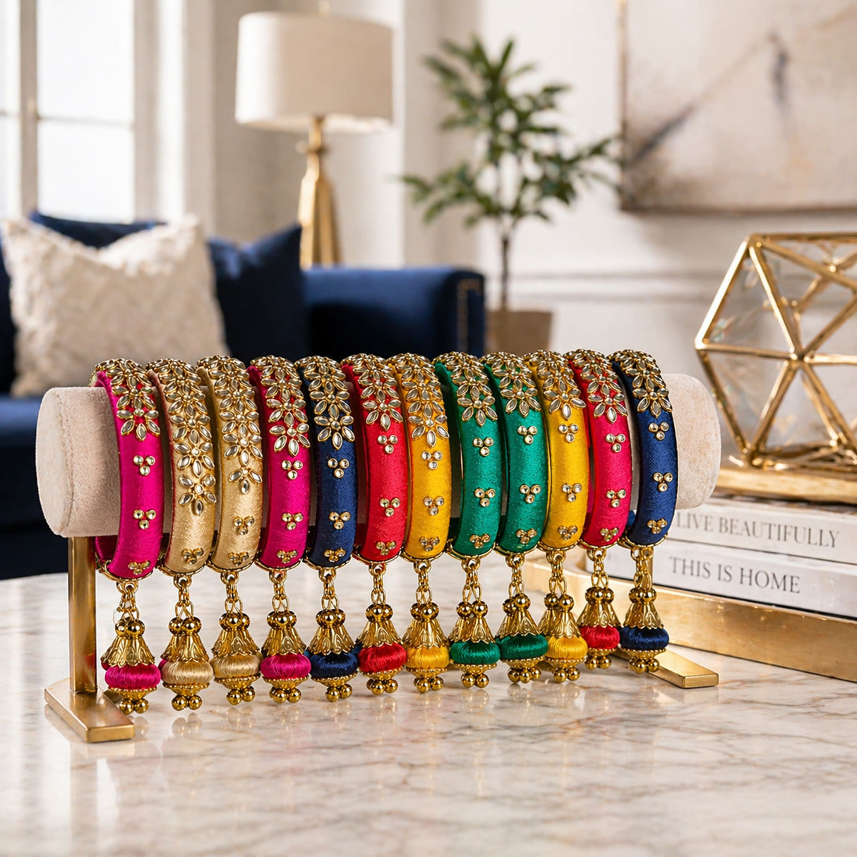 A set of vibrant silk thread bangles with gold kundan floral designs and tassels in assorted colors for Indian weddings
