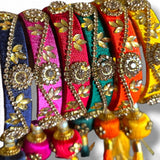 Silk thread bangles for women in navy pink red green and orange with kundan style work and gold leaf motifs for weddings and festivals