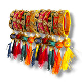 Silk thread bangles for women in red green and yellow with kundan-style gold floral embroidery and multi-colored tassels for festivals