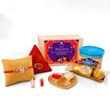 Gold-colored heart-shaped pure silver thali with red and white powders for bhai dooj gift hamper for brother