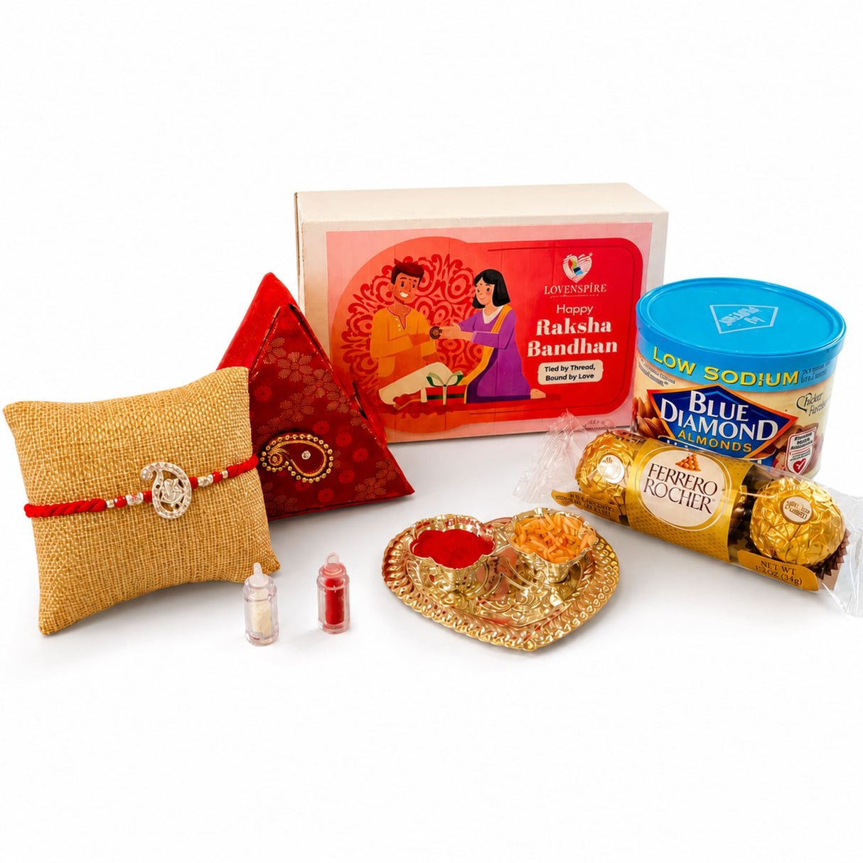 Gold-colored heart-shaped brass tray with red powder and orange sweets in pure silver Ganesha Rakhi gift hamper for brother