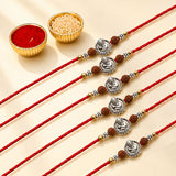 Designer silver tone Ganesha rakhi with red cord and brown beads for brother and bhabhi Raksha Bandhan protection