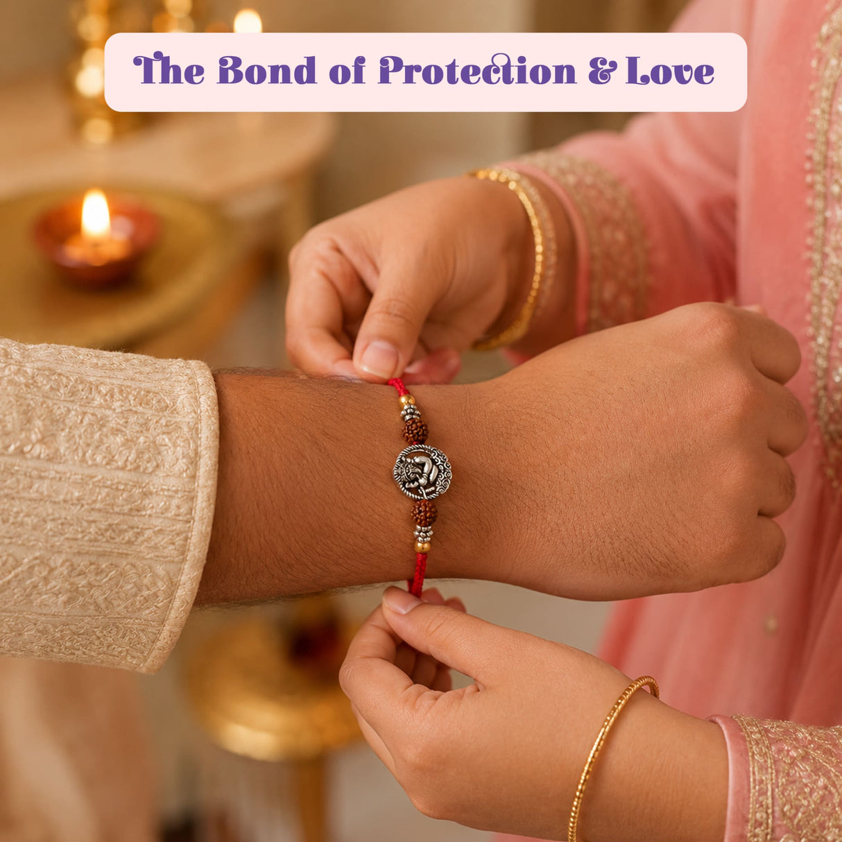 Designer silver tone ganesha rakhi with red thread and silver pendant featuring engraved design for raksha bandhan