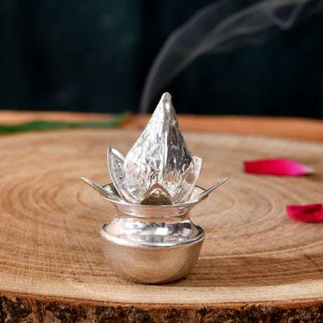 Silver plated mini mangal kalash incense burner with lotus shape textured reflective surface for pooja decor
