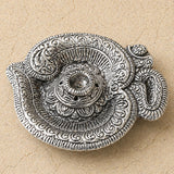 Silver-toned metal om incense holder with intricate swirling filigree aluminum ash catcher and conical tray for temple decor