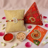Designer pure silver and red om rakhi with diamond-encrusted om design and beads for raksha bandhan protection