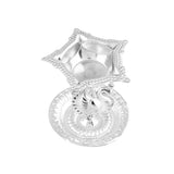 Silver plated star-shaped diya with intricate bead detailing and decorative peacock base for home pooja mandir