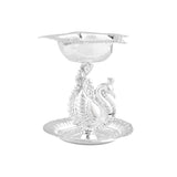 Silver plated peacock diya oil lamp with intricate detailing and reflective finish for home pooja mandir and Diwali decor