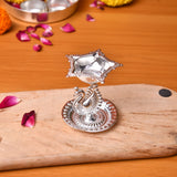 Silver plated intricate diya with peacock motif base and star shaped top for home pooja and Diwali decor