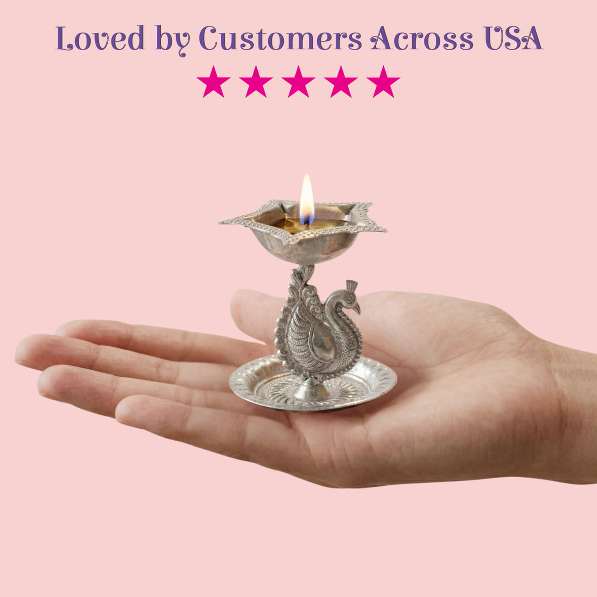 Silver plated peacock diya oil lamp with intricate engravings and lit flame for home pooja mandir and Diwali decor