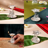 Silver plated peacock diya oil lamp with intricate engravings and star shaped holder for home pooja mandir and diwali decor