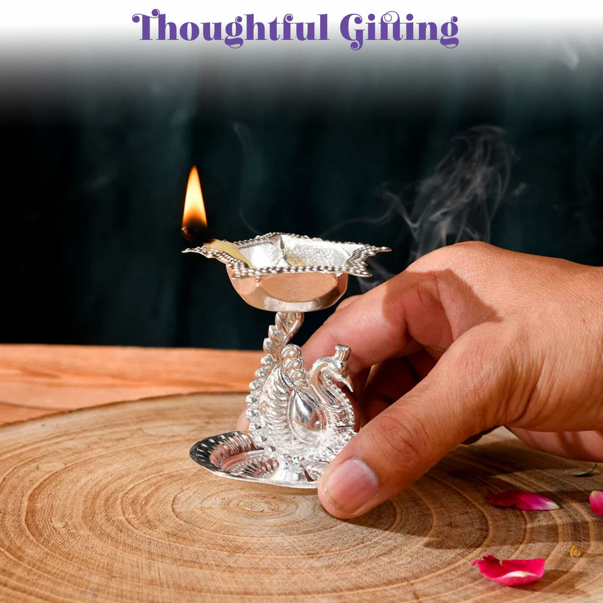 Silver plated peacock diya oil lamp with intricate design and lit flame for home pooja mandir and diwali decor