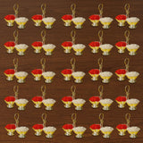 Silver plated haldi kumkum holder with gold-colored twin bowls containing red and white powders for Indian festival puja