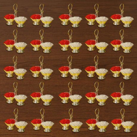 Silver plated haldi kumkum holder with gold-colored twin bowls containing red and white powders for Indian festival puja