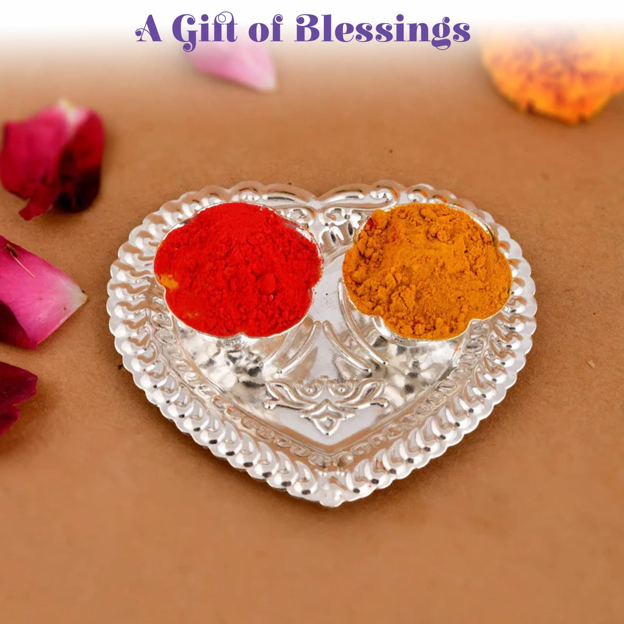 Heart-shaped silver plated haldi kumkum holder with two compartments containing red and orange powders for puja