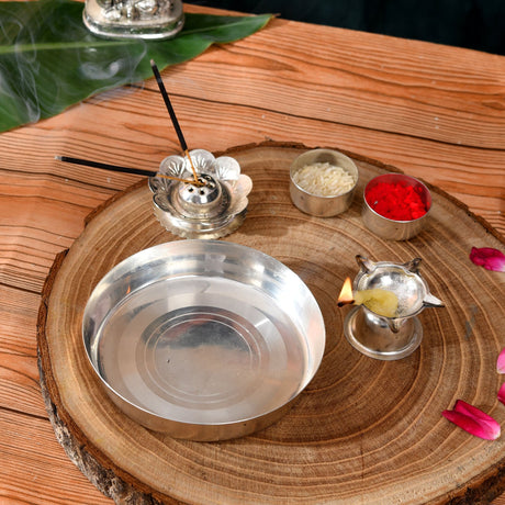 Silver plated incense burner with petal-shaped design and two black sticks in 5-piece pooja thali set for rituals