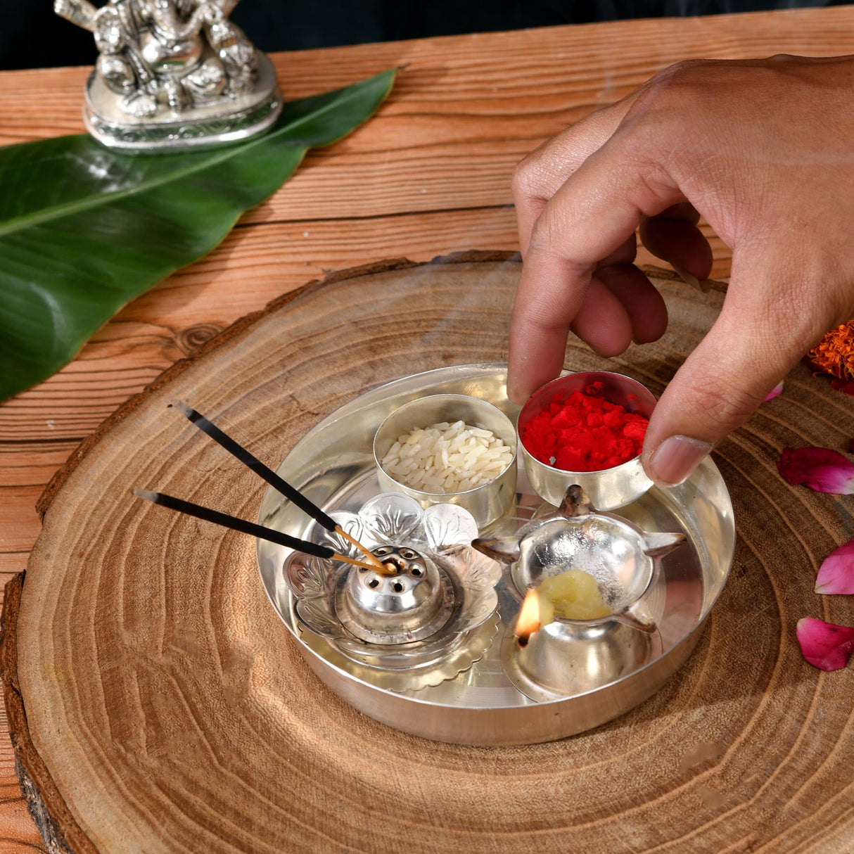Silver metallic incense burner with intricate floral detailing and small flame for 5-piece silver plated pooja thali set