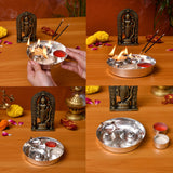 Silver plated pooja thali set with intricate embossed design and multiple compartments for diya incense and powders
