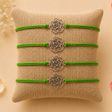 Four green cord rose charm rakhis with silver accents for brother and bhabhi traditional protection bracelets