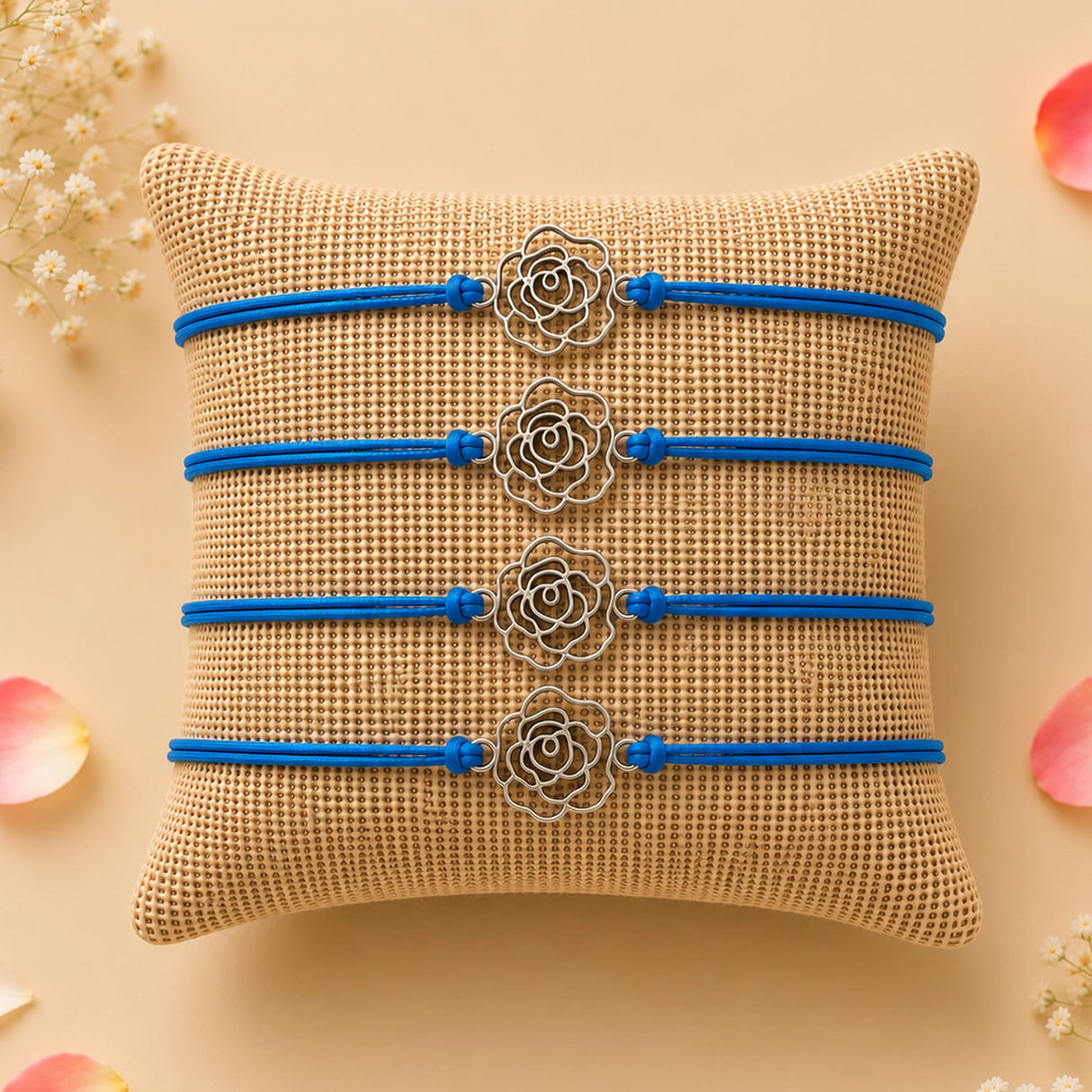 Four blue cord rose charm rakhis with silver toned metal roses traditional handmade raksha bandhan bracelets