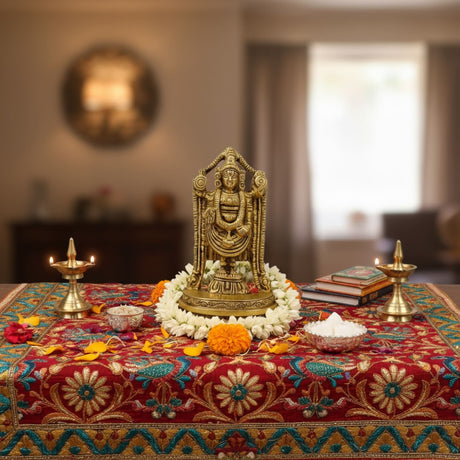 Golden brass Balaji and Venkateswara deity statue with floral garland and ornate throne
