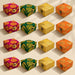 Small handmade square jewelry boxes in magenta green yellow and orange with gold brocade and metallic clasps for weddings