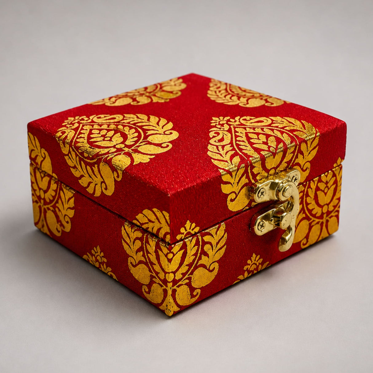 Small handmade jewelry box in red fabric with gold damask pattern and brass clasp for indian pakistani wedding favors