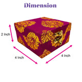 A square small handmade jewelry box in vibrant magenta brocade with golden floral patterns and metallic clasp for wedding favors