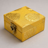 Small handmade golden brocade jewelry box with intricate paisley patterns and vintage brass clasp for wedding favors