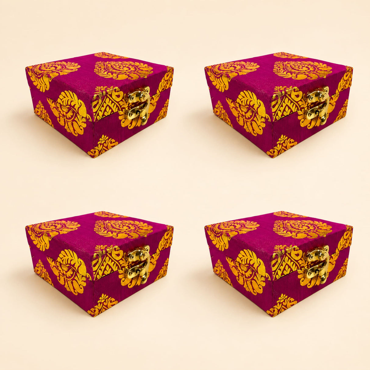 Vibrant magenta brocade fabric gift box with intricate gold gota patti floral patterns and brass clasps for weddings