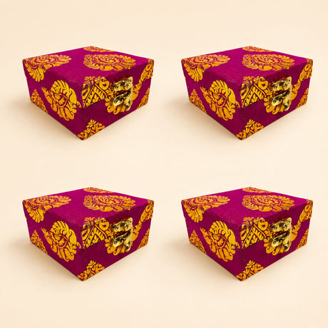 Vibrant magenta brocade fabric gift box with intricate gold gota patti floral patterns and brass clasps for weddings