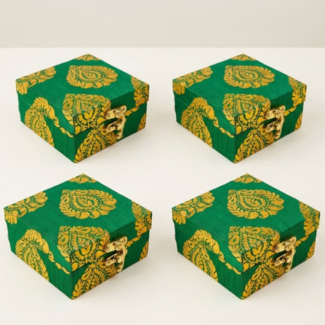 Four green and gold paisley brocade fabric gift boxes with gota patti work and golden clasps for weddings and celebrations