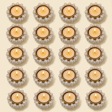 Bulk small pearl-encrusted gold tealight candle holders with lit candles for festive home decor and dining table centerpiece