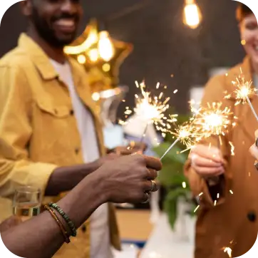 Sparklers being held during a celebration.
