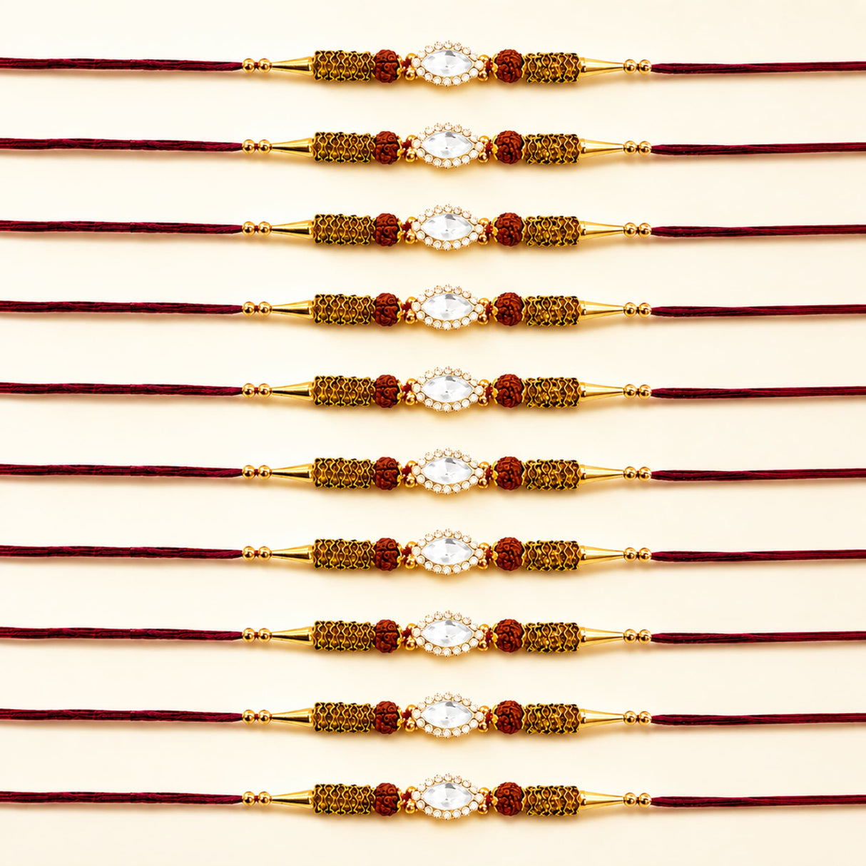 Designer stone rakhi gold plated with central white stone red beads and mesh detailing for Raksha Bandhan protection
