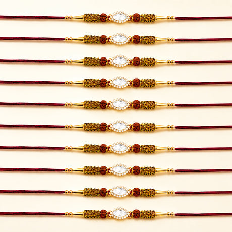 Designer stone rakhi gold plated with central white stone red beads and mesh detailing for Raksha Bandhan protection
