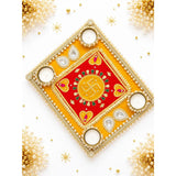 Decorative swastik rangoli mat with a golden and red embroidered diya tray featuring four pearl and gemstone adorned tealight holders