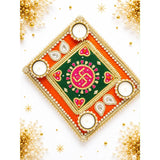 Decorative swastik rangoli mat with ornate square diya holder featuring vibrant orange green fabric gold trim pearls and rhinestones