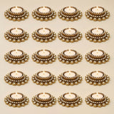 Gold-colored ornate tea light candle holders with intricate beaded detailing for traditional diya stand and festive home decor