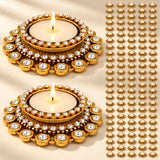 Gold-colored tea light candle holders adorned with sparkling clear crystals traditional diya stand for diwali decor