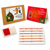 Set of six colorful thread ghungroo rakhis with gold beads displayed on white tray for brother and bhabhi gift