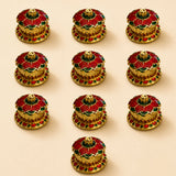 Golden incense burner with red and green enamel floral design traditional floral red haldi kumkum holder for pooja