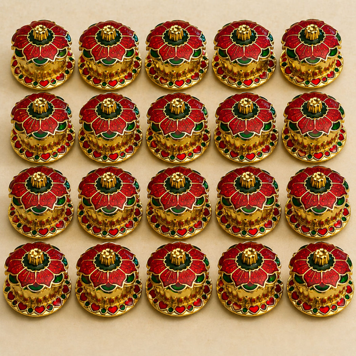 Traditional floral red haldi kumkum holder featuring red and green enamel flower buttons with gold-toned metal centers