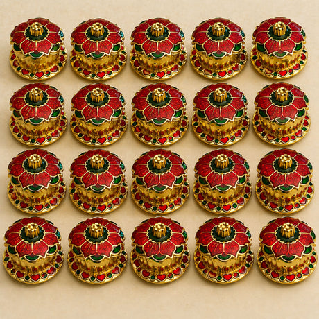 Traditional floral red haldi kumkum holder featuring red and green enamel flower buttons with gold-toned metal centers
