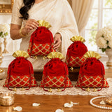 Traditional indian velvet potli bags red with gold lattice embroidery and golden fluted tops for festive gifting