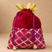 Traditional Indian velvet potli bag in red and magenta with gold gota patti lattice work and golden bow for festive use