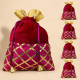 A rich red velvet potli bag with magenta silk lower section and gold gota patti embroidery for festive use