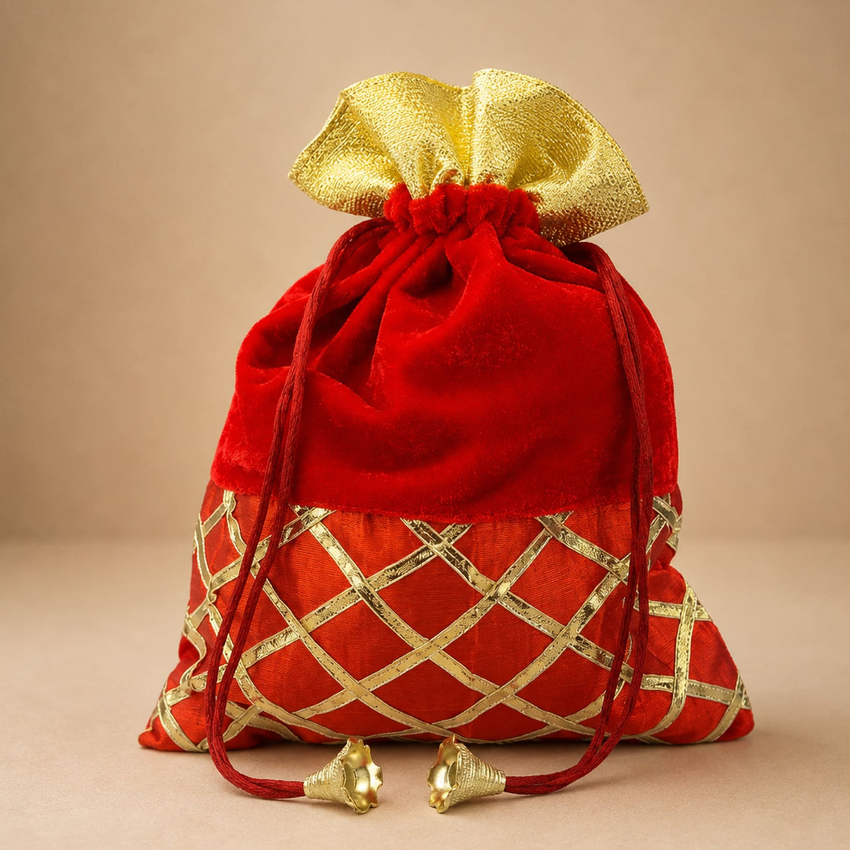 Red velvet drawstring potli bag with gold metallic lattice and matching bow for pooja eid festive party and wedding gifts